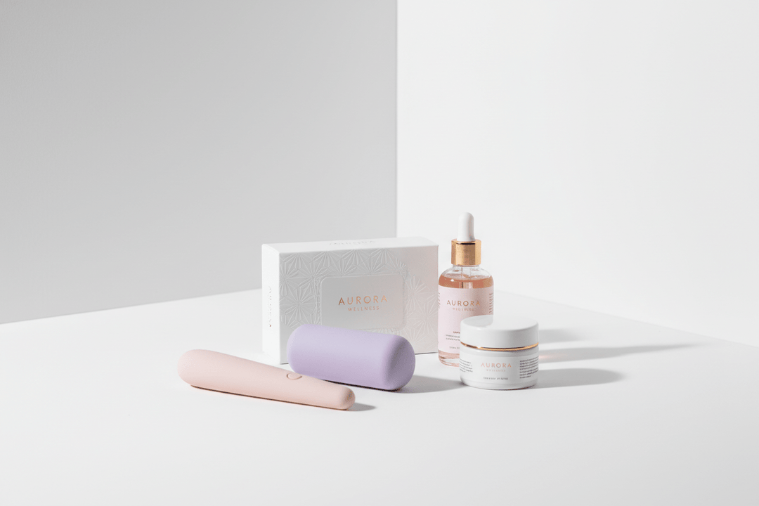 Aurora Wellness vibrator in blush pink, body-safe silicone, sleek design with matching storage case.