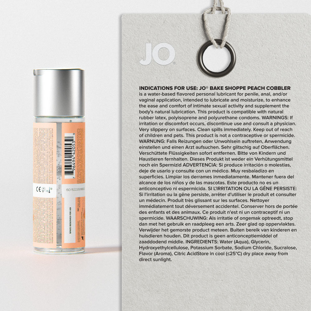 Back of the Peach Cobbler bottle beside its printed directions and ingredients panel