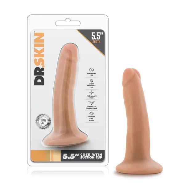 Dr. Skin 5.5 inch cock with suction cup in flesh tone, beside its blister pack
