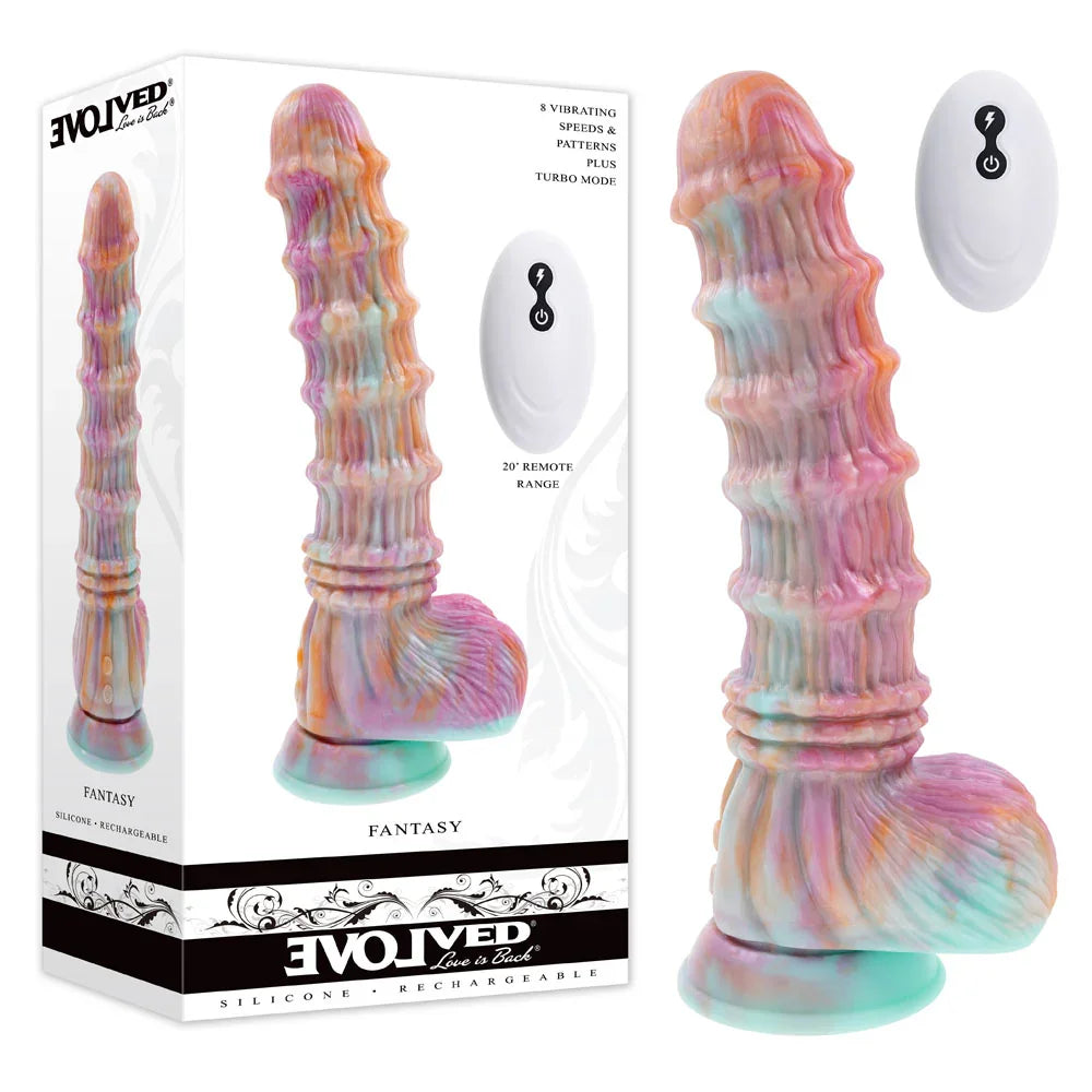 Evolved Fantasy vibrating dildo in iridescent multicolour with its remote, beside the retail box