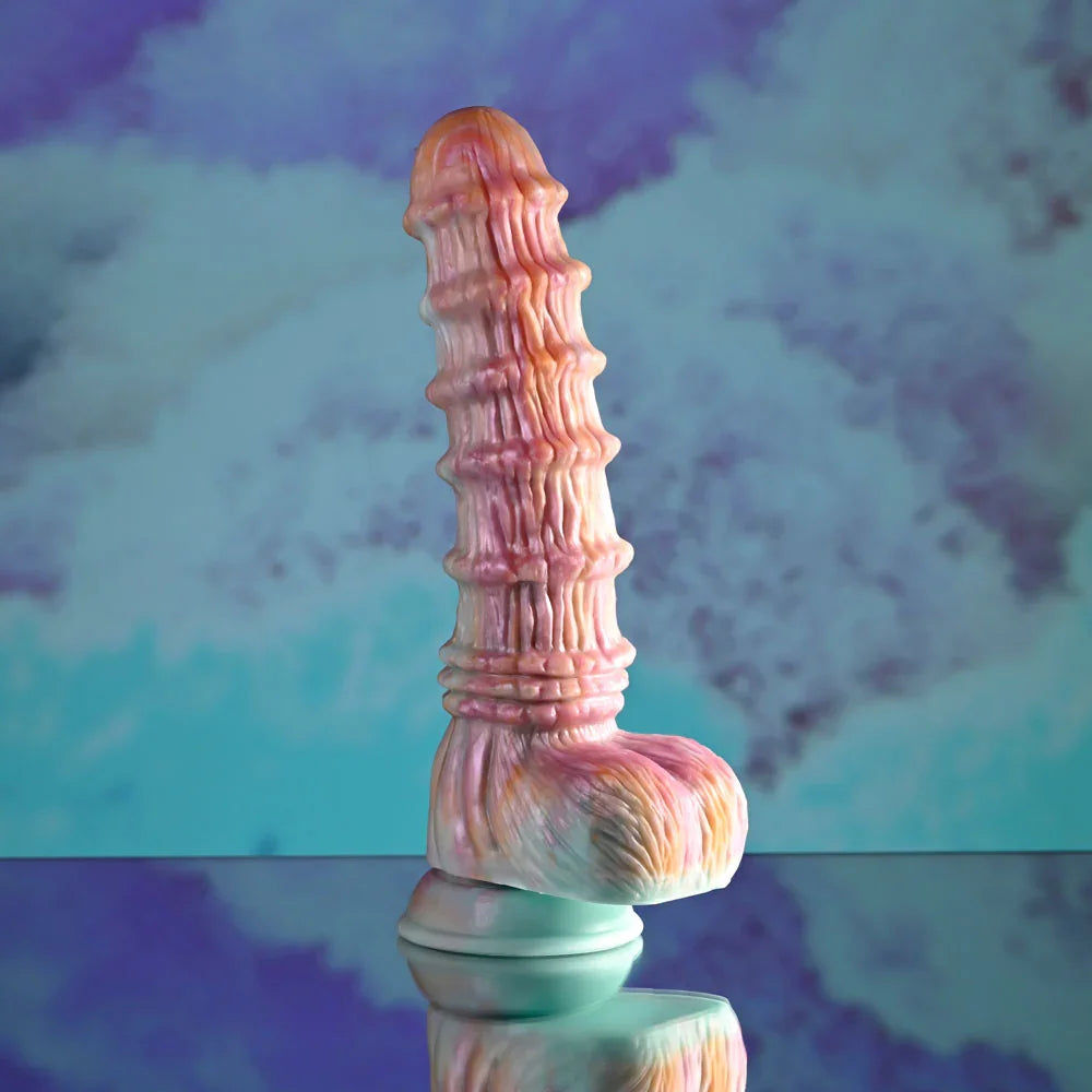 Evolved Fantasy dildo in multicolour standing alone, showing the ridged shaft and moulded balls