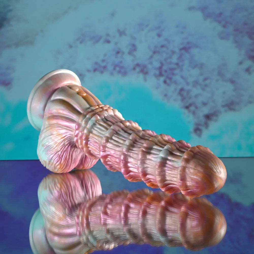 Evolved Fantasy dildo in multicolour laid flat, suction cup to the left, mirrored reflection below