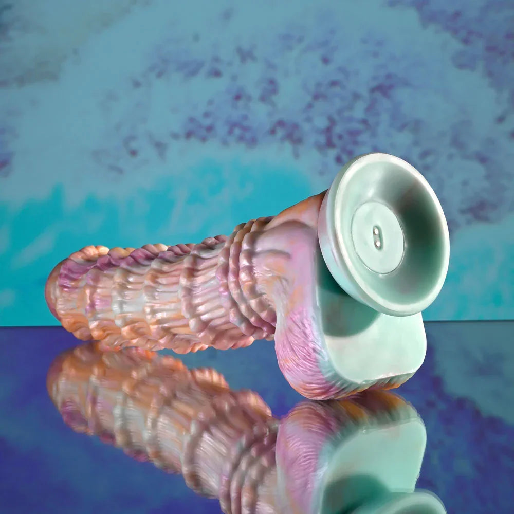 Evolved Fantasy dildo in multicolour tipped up to show the underside of its mint suction base