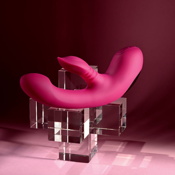 Evolved Gentle Persuasion in Pink lying flat across the glass cubes, tip to the right