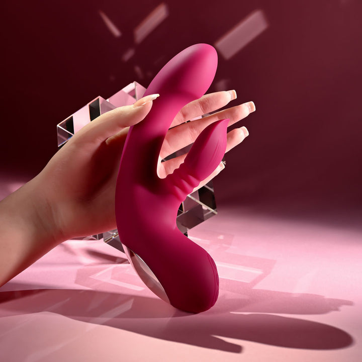 Evolved Gentle Persuasion in Pink held in a hand for scale, pink backdrop
