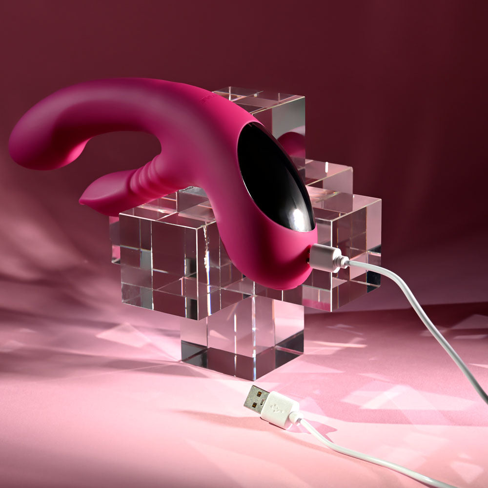Evolved Gentle Persuasion in Pink on the glass cubes with its USB charging cable attached