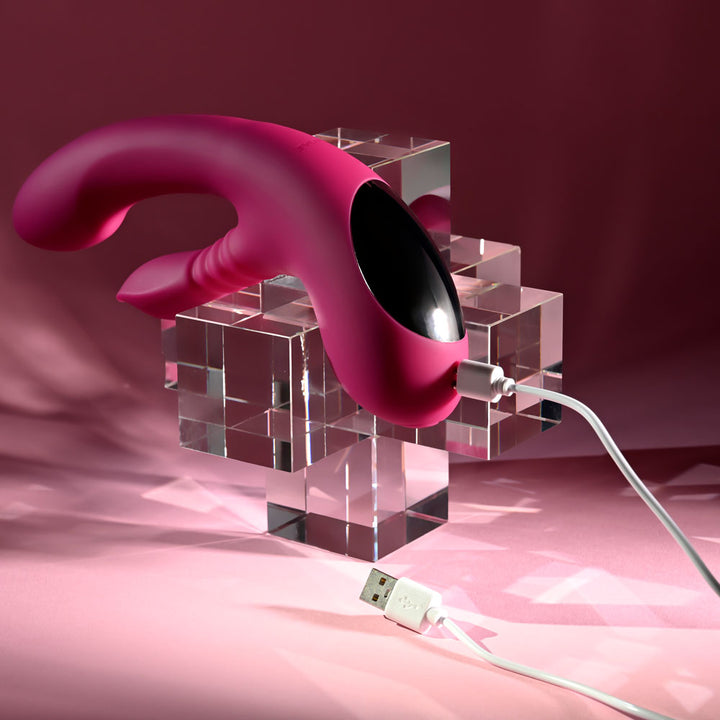 Evolved Gentle Persuasion in Pink on the glass cubes with its USB charging cable attached
