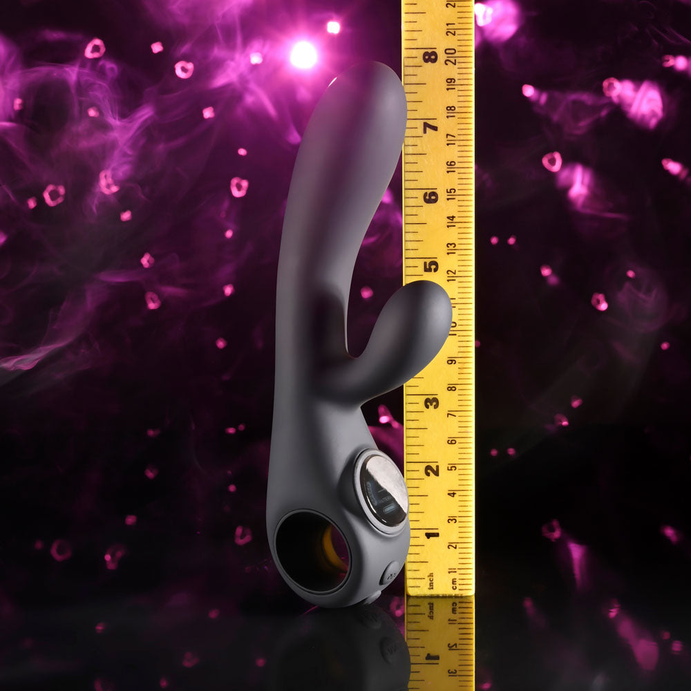 Evolved Black Magic in Black upright against a tape measure, reading about 8 inches