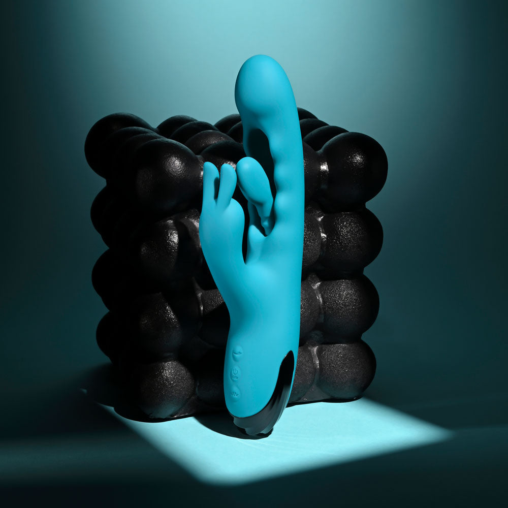 Evolved Bunny Tapper in Teal upright and angled left, rabbit ears facing the camera