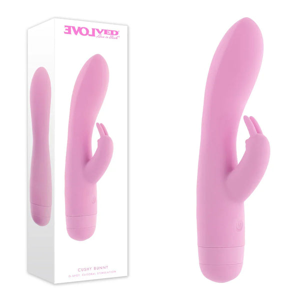 Evolved Cushy Bunny retail box beside the soft Pink rabbit vibrator with its twist base
