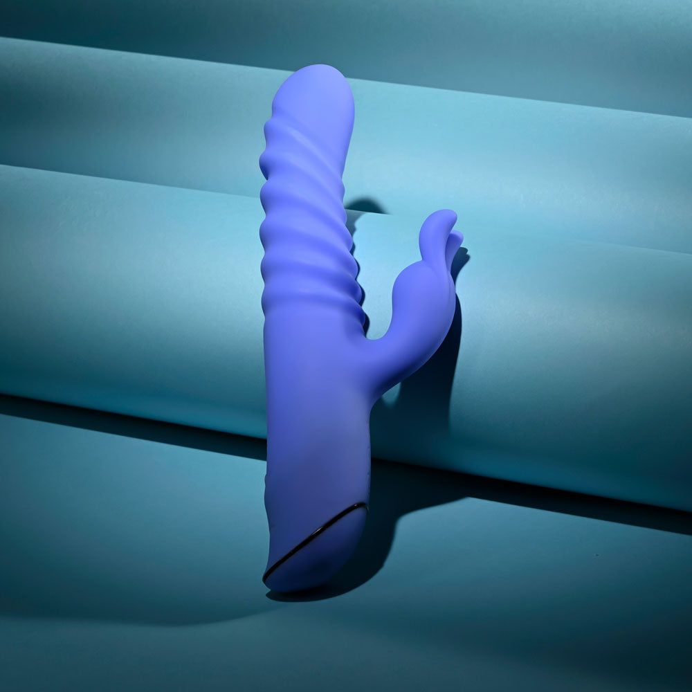 Evolved Knock Knock in blue-violet standing free on a teal tube, rabbit ears to the right
