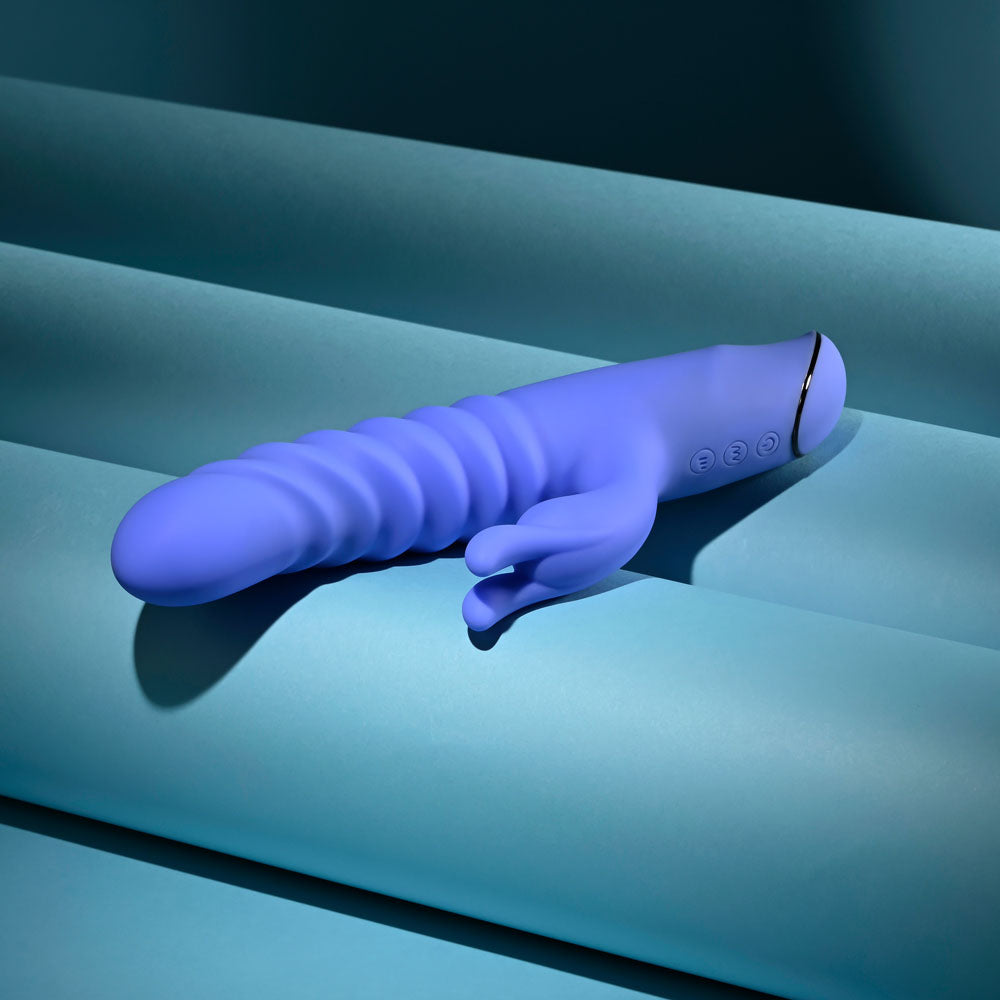 Evolved Knock Knock in blue-violet lying flat, showing the control buttons on the handle