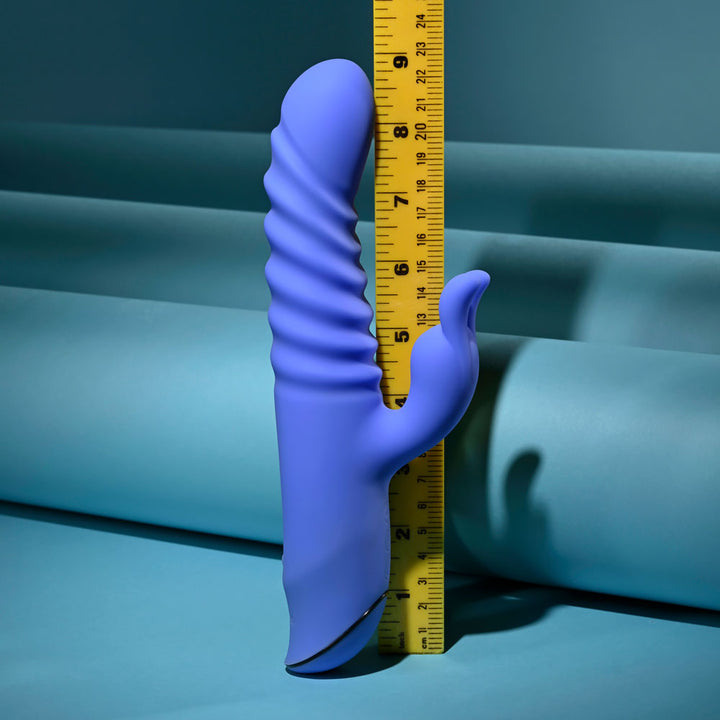 Evolved Knock Knock in blue-violet beside an upright tape measure, reading about 9 inches