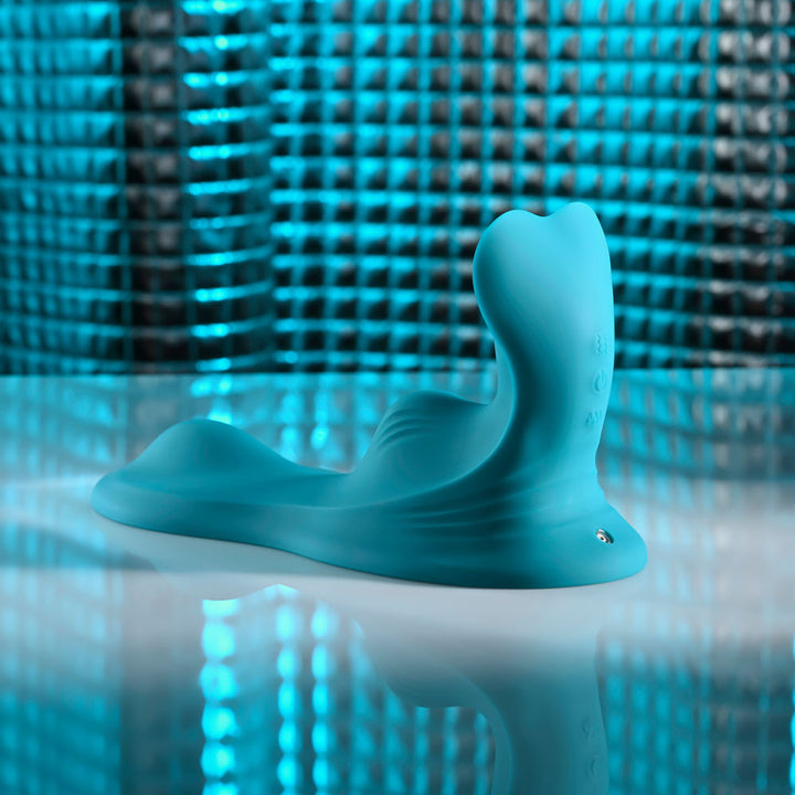 Evolved Bump & Grind in Teal at three-quarter angle, tail of the base to the left
