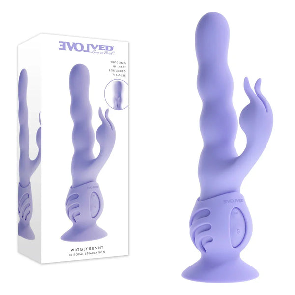 Evolved Wiggly Bunny retail box beside the lilac rabbit vibrator on its ribbed suction base