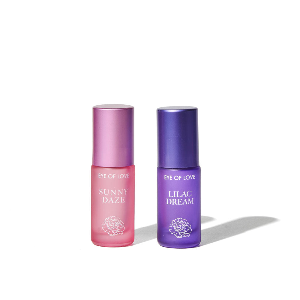 Sunny Daze and Lilac Dream roll-on bottles side by side on plain white