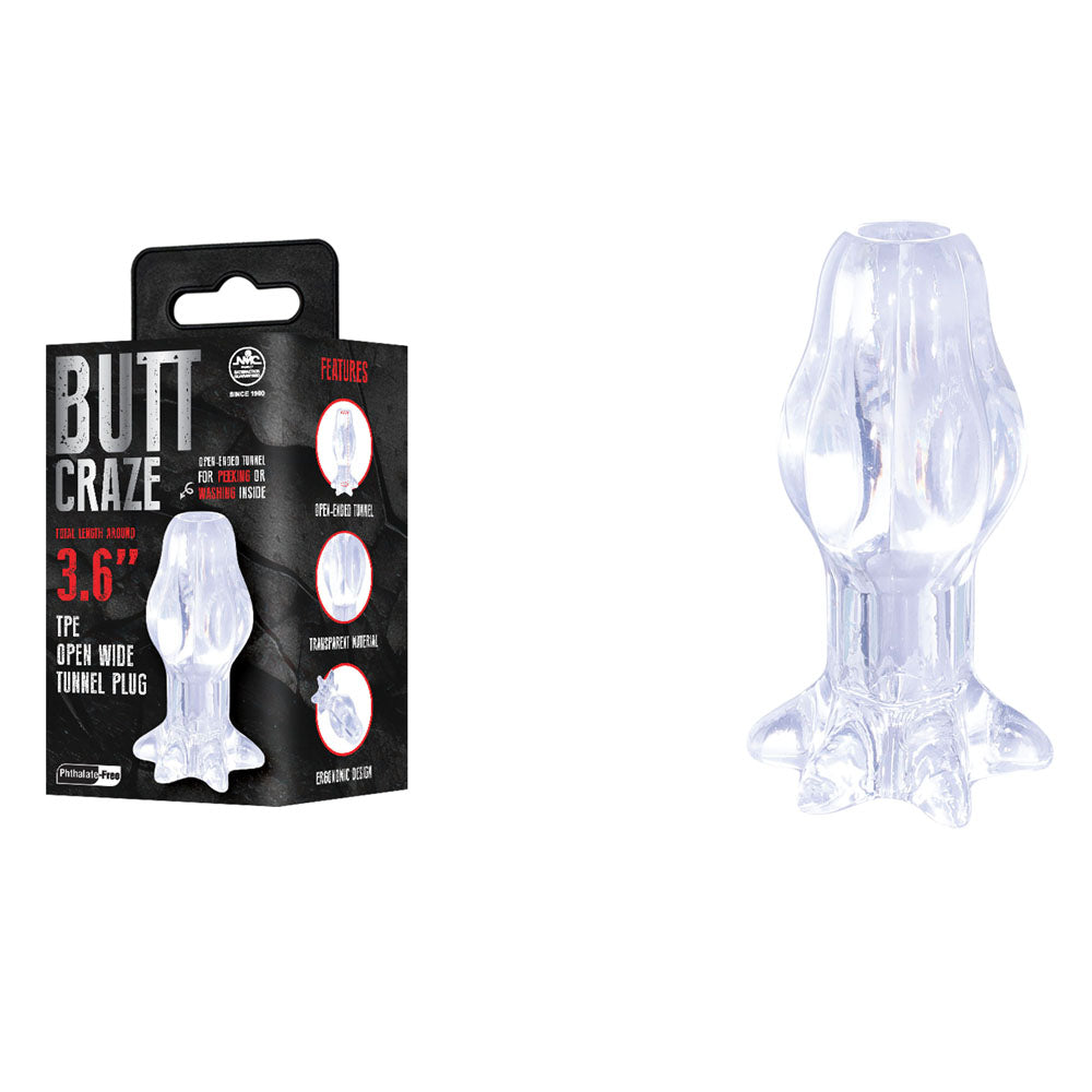 Butt Craze 3.6 inch tunnel plug in Clear, closed petal tip, beside its black box
