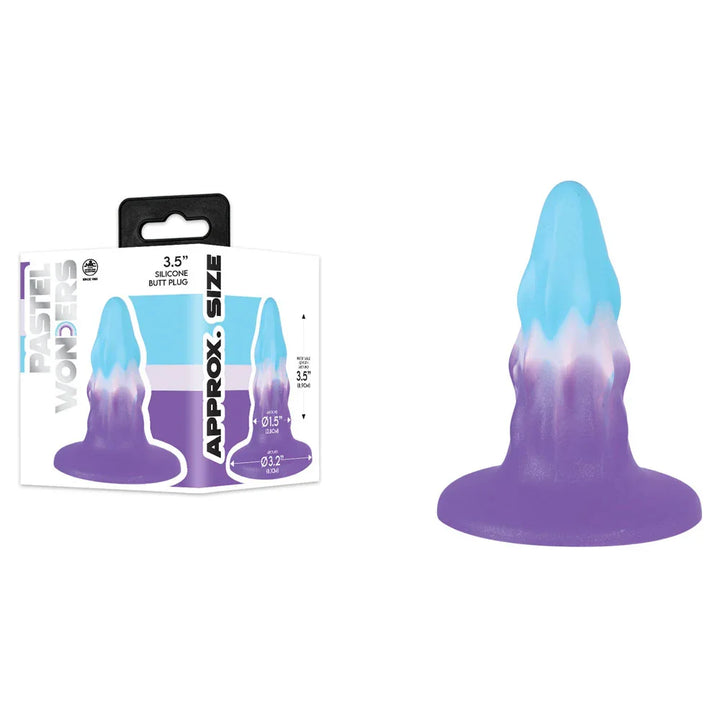 Pastel Wonders 8.9 cm plug in Blue, White and Purple drip pattern, beside its box