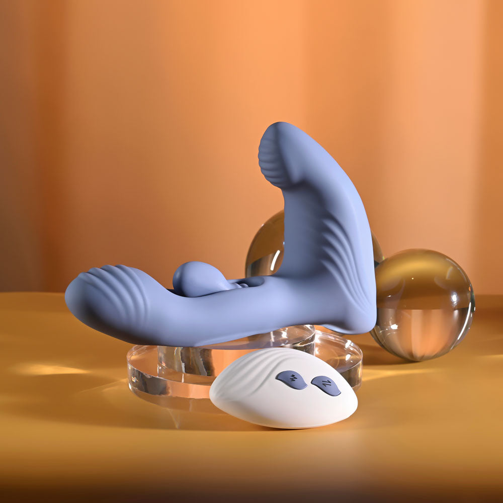 Gender X Flapjack in Blue on a clear riser, remote resting in front