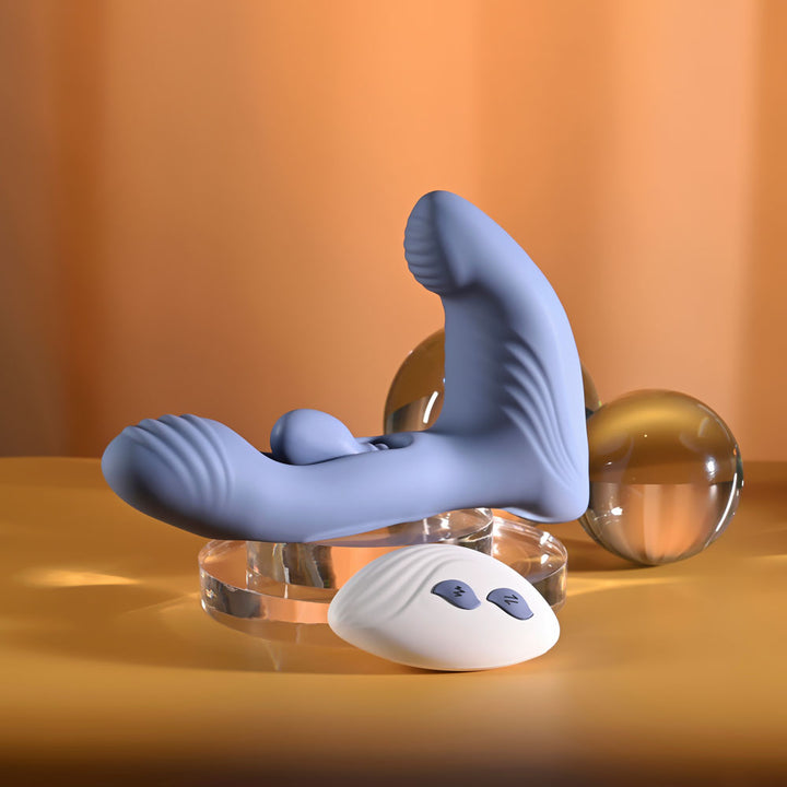 Gender X Flapjack in Blue on a clear riser, remote resting in front