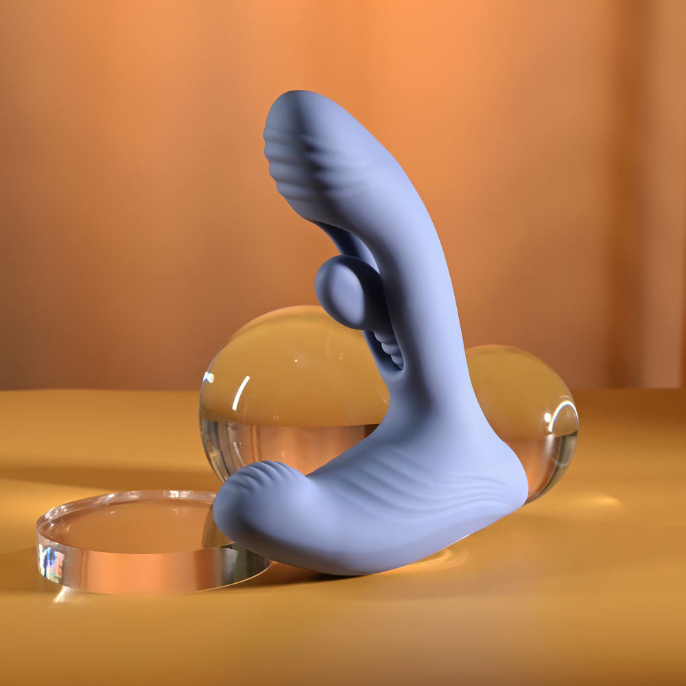 Gender X Flapjack in Blue balanced on a glass sphere, front view