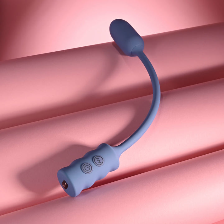 Gender X Egg-Streme in Purple curved upright with the handle resting on pink