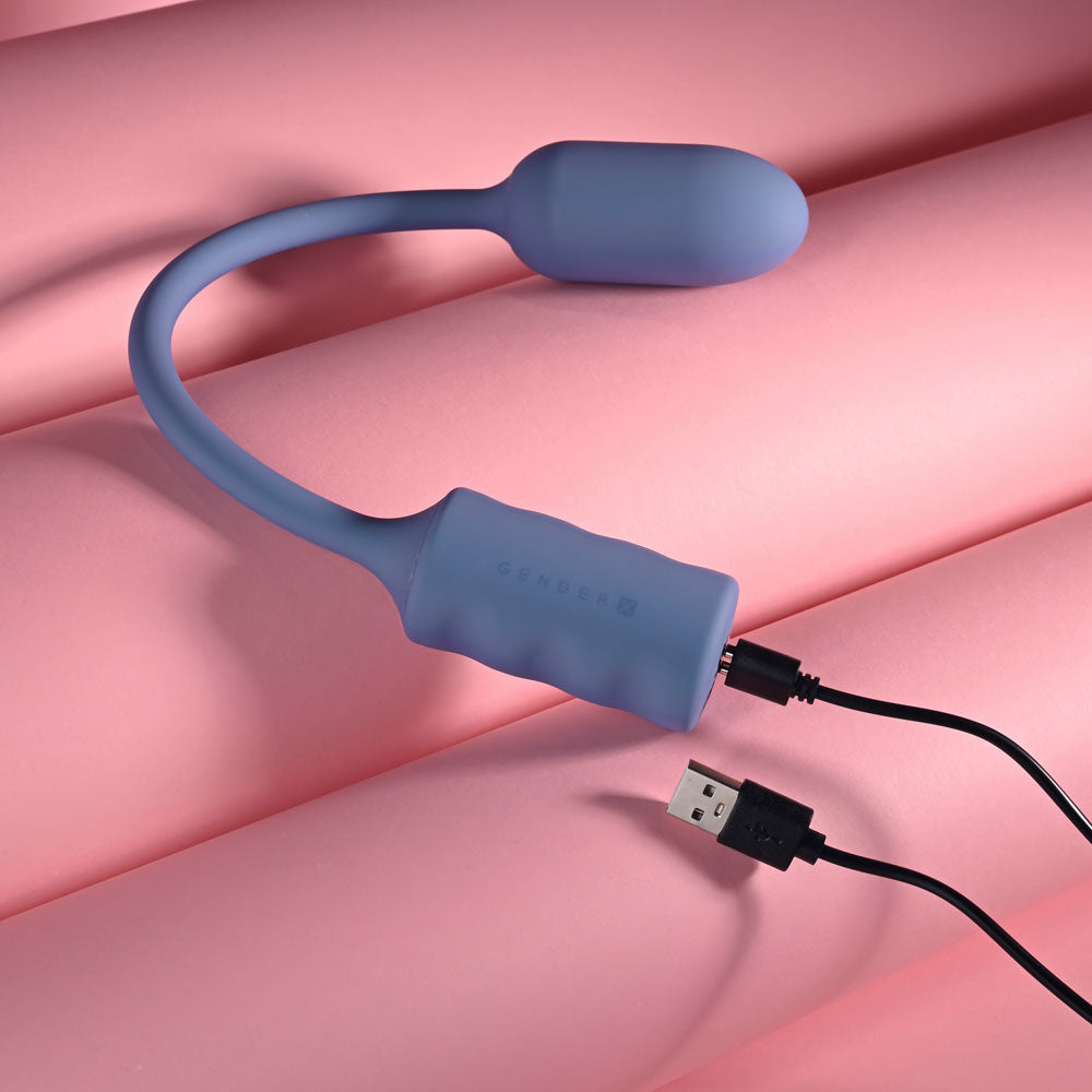 Gender X Egg-Streme in Purple with its USB charging cable attached
