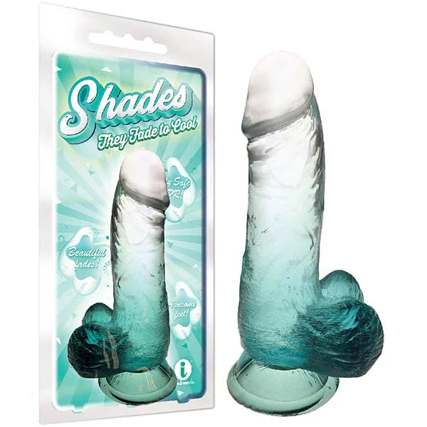 Shades jelly dong fading clear to emerald on a suction base, beside its blister pack