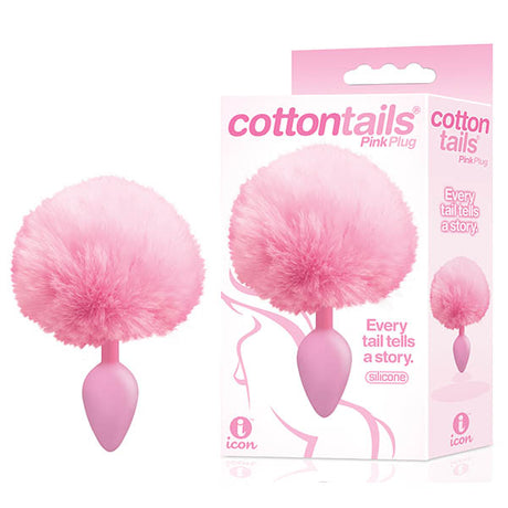 Image of The 9s Cottontails - Pink Butt Plug with Bunny Tail, featuring a fluffy pink tuft and smooth silicone plug. Next to it is the packaging with the design and slogan Every tail tells a story. Grab it at the lowest price available.