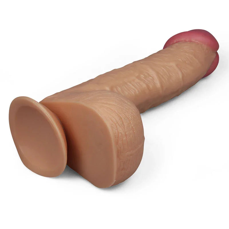 King Size 10.5 inch dildo lying down, seen from behind the large flat suction cup
