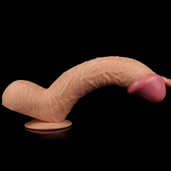 King Size 10.5 inch dildo curved on its suction cup against black, head raised