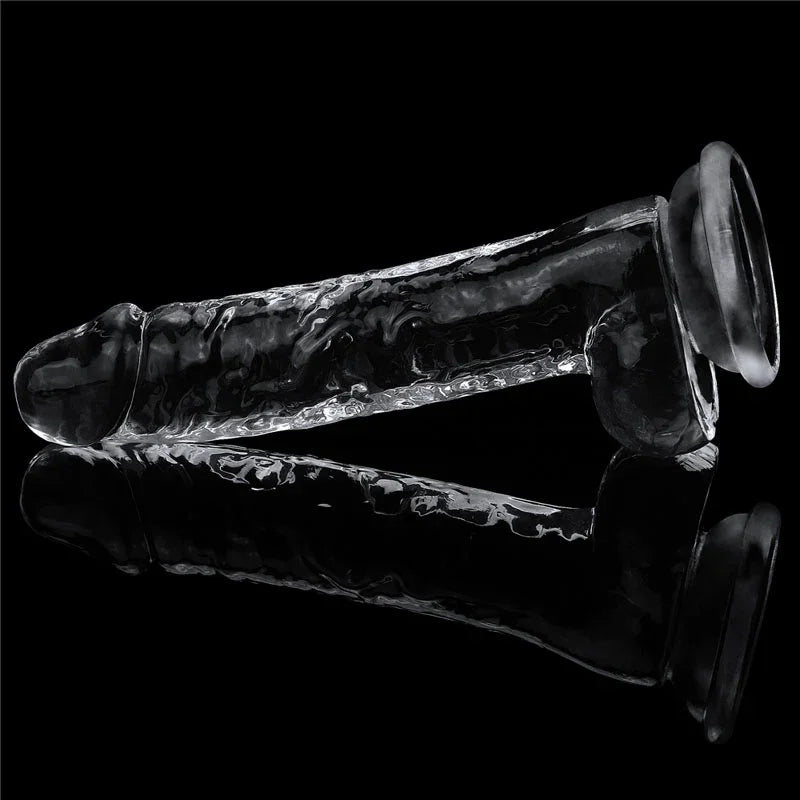 Flawless Clear 7.5 inch dildo lying on a mirrored black surface with its reflection beneath