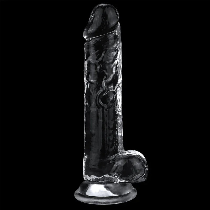 Flawless Clear 7.5 inch dildo standing upright on its suction base against black