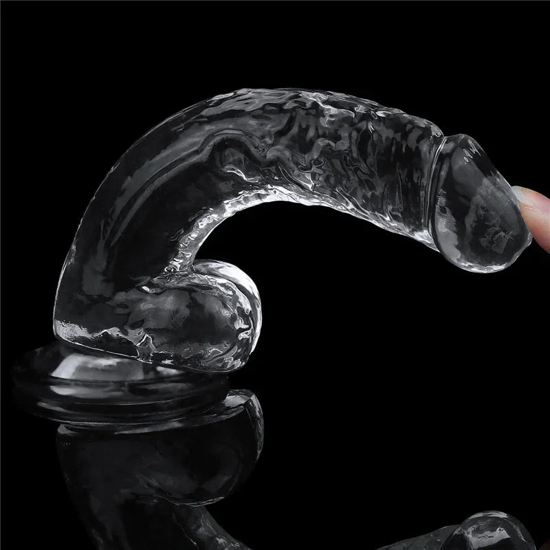 Flawless Clear 7.5 inch dildo bowed forward on its base, showing how much the clear shaft flexes