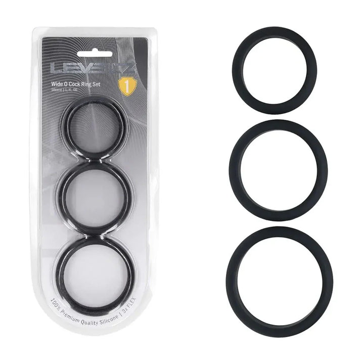 LEVELZ Wide O Silicone Cock Ring Set of 3 in Black, blister card beside the three flat rings in a column