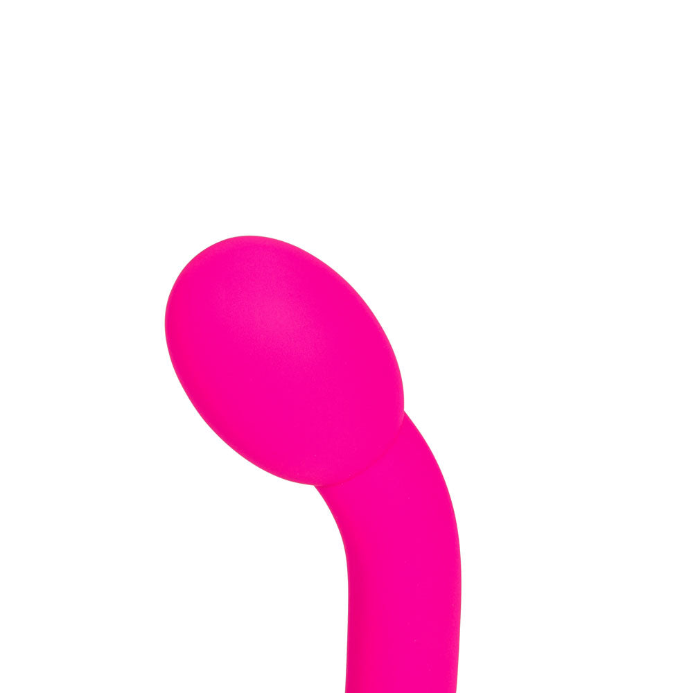 The Maia KORA is a 17.8 cm bright pink G-Spot vibrator with a curved shape and rounded bulbous tip, coated in smooth silicone. USB rechargeable and set against a plain white background that highlights its vibrant color.