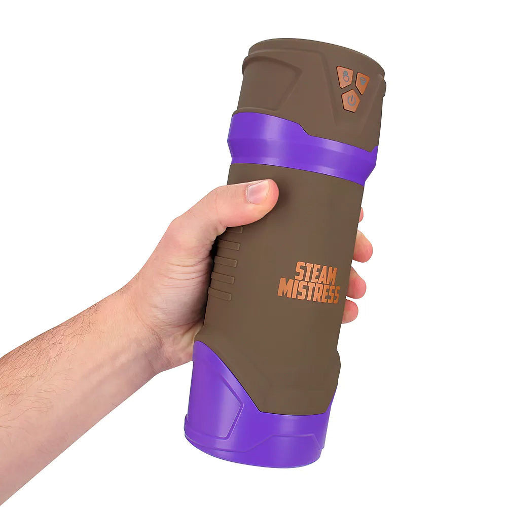 MASTURS Misty Auto Stroker, held in one hand to show the size of the brown and purple body