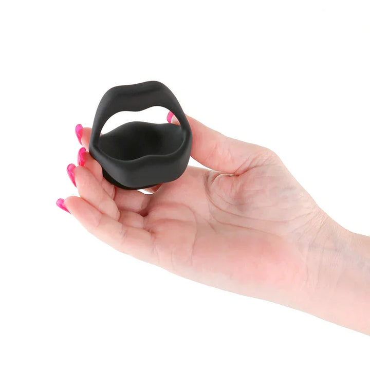 Techno Strobe vibrating cock ring in Black held in a hand, showing its scale