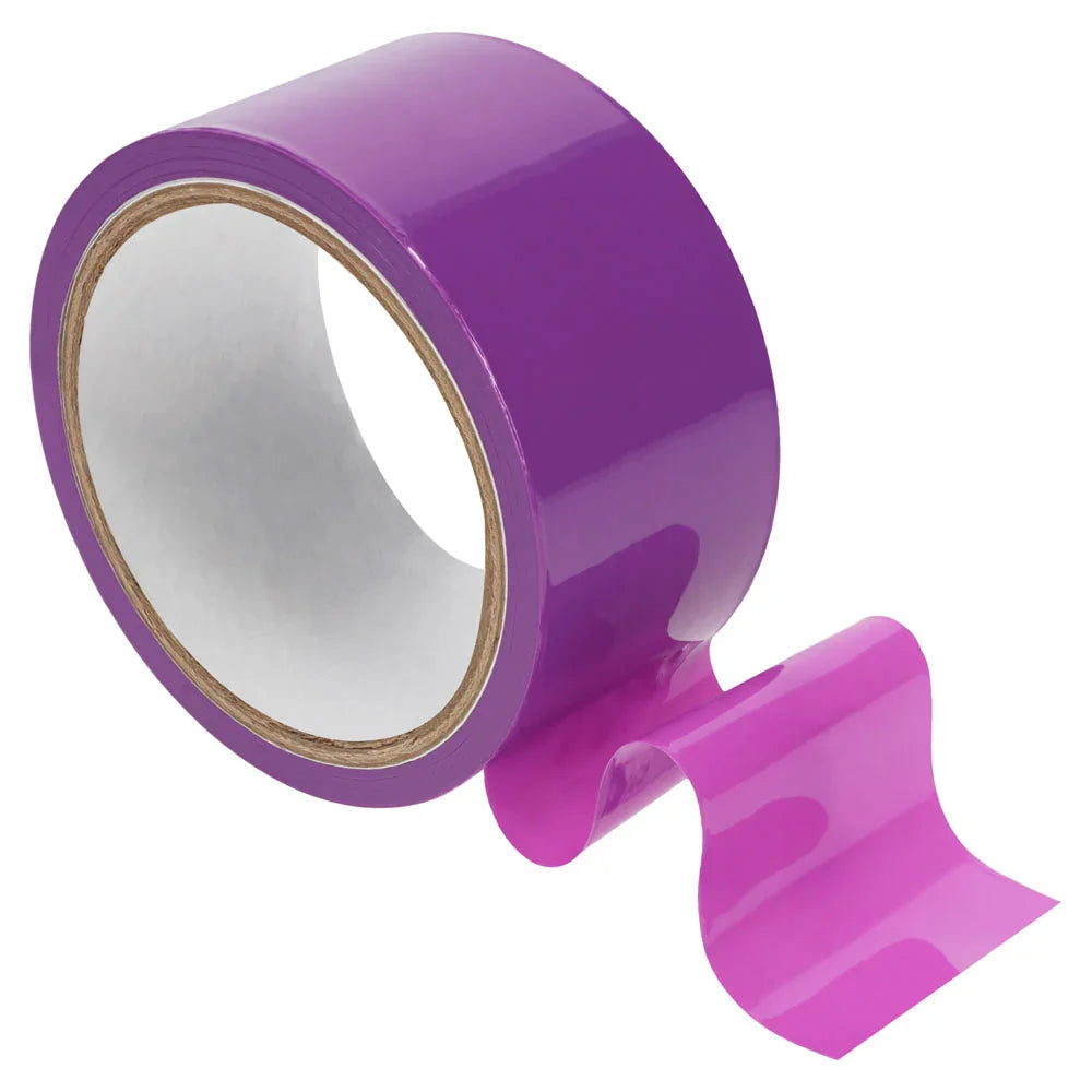 OUCH! PVC Non-Stick Bondage Tape 20m in Purple, glossy purple roll with a length unwound beside it