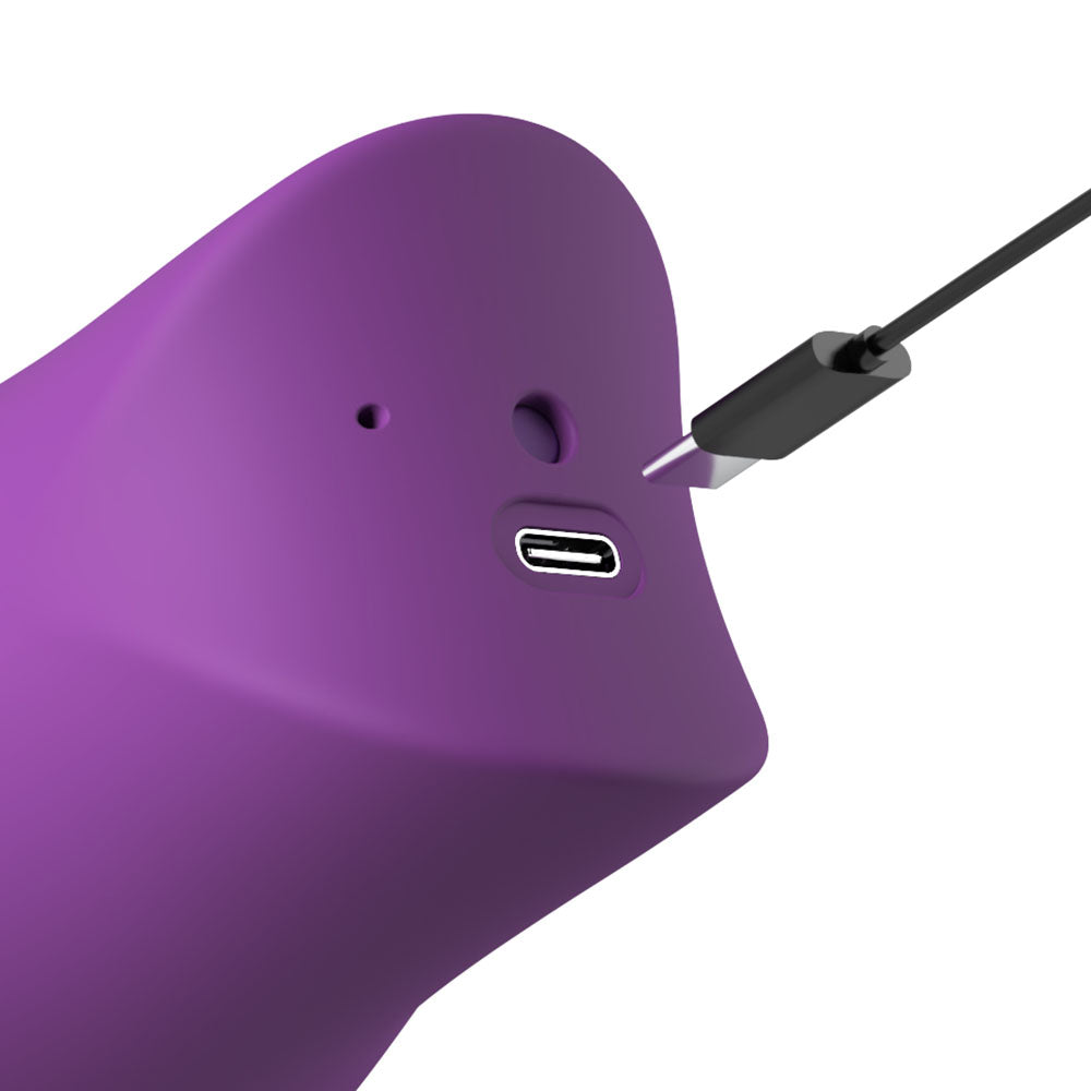 USB-C charging cable meeting the port on the purple Lush Kiss Plush handle