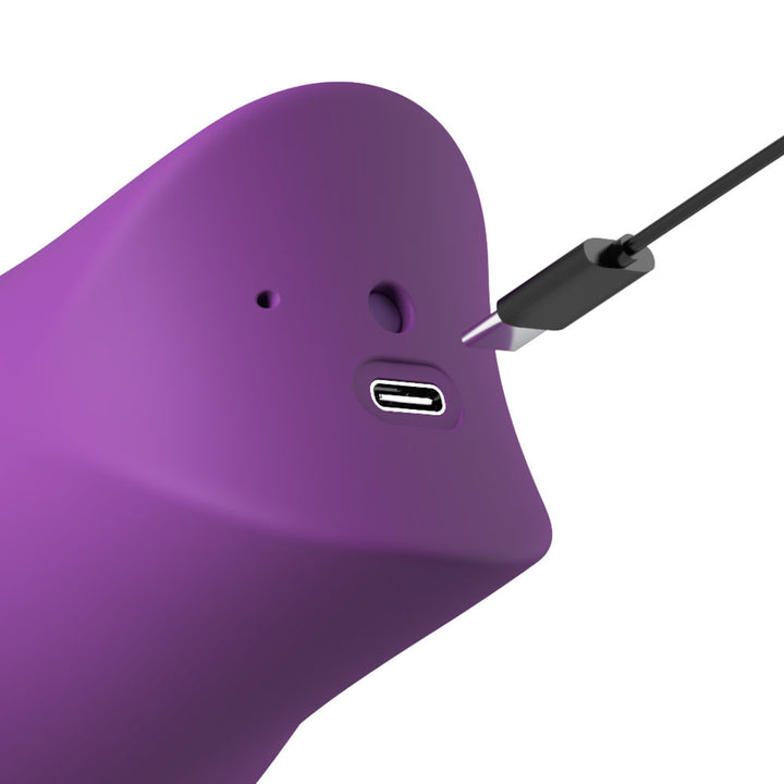 USB-C charging cable meeting the port on the purple Lush Kiss Plush handle