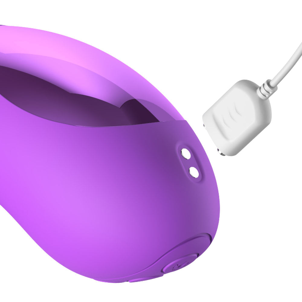 Magnetic charging cable approaching the contacts on the intiMotion G-Pro base