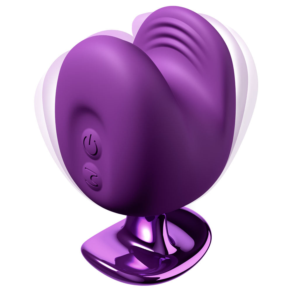 Luv Bites stimulator in purple, two ribbed lips on a chrome-effect base, motion blur