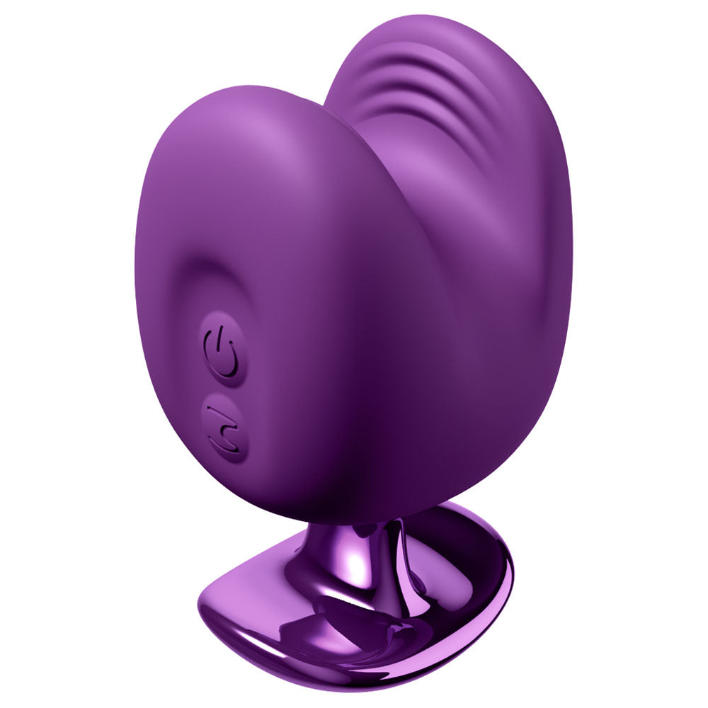Luv Bites stimulator at rest on its shiny purple stand, ridged upper lip visible