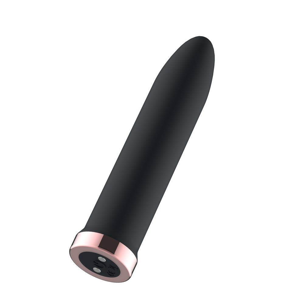 Passion Play Rechargeable Vibrating Bullet in Black tilted to show the rose gold charging base