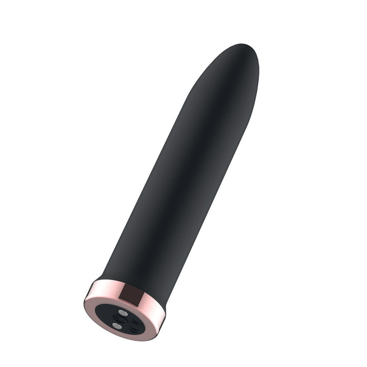 Passion Play Rechargeable Vibrating Bullet in Black tilted to show the rose gold charging base