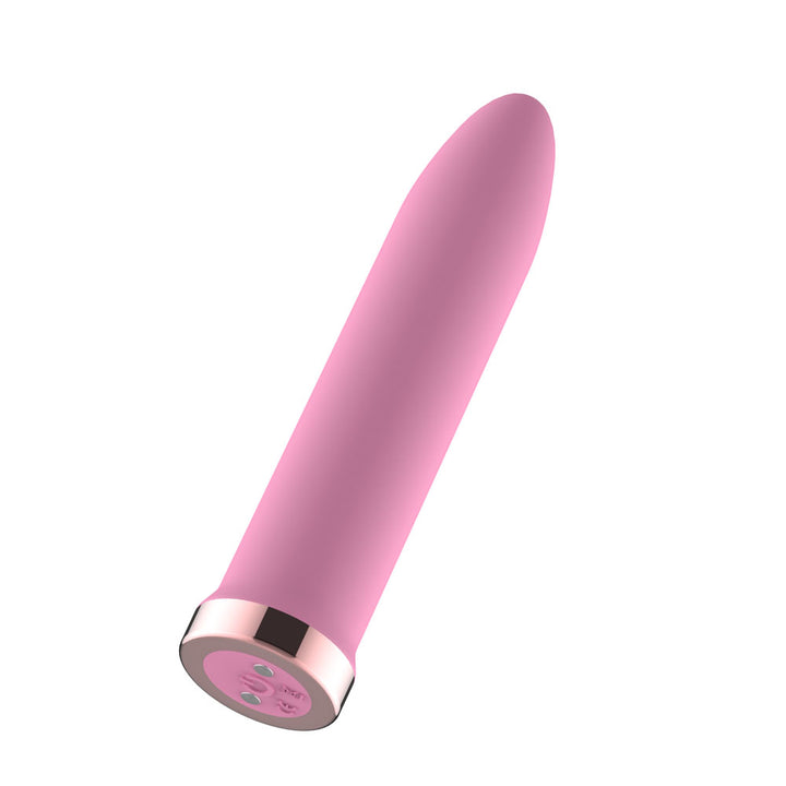 Passion Play Rechargeable Vibrating Bullet in Pink tilted to show the rose gold charging base