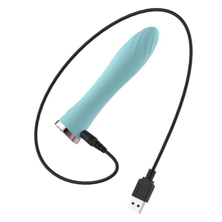 Passion Play Ultra Power Vibrating Bullet in Blue with its USB charging cable plugged in