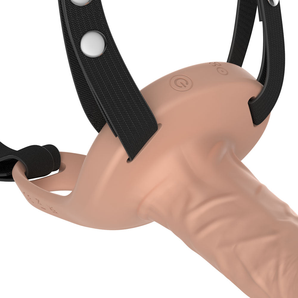 Close-up of the Flesh realistic sleeve's veined shaft and the harness straps holding it