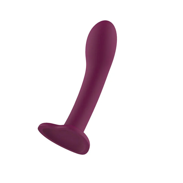 Passion Play Liquid Silicone Dildo in Purple tilted back on its suction base, tapered tip